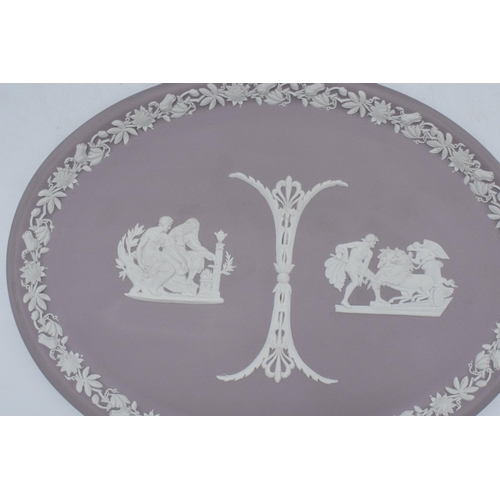 78 - A pair of Wedgwood Jasperware oval plaques to include lilac example and dark blue 'Royal Pavilion Br... 