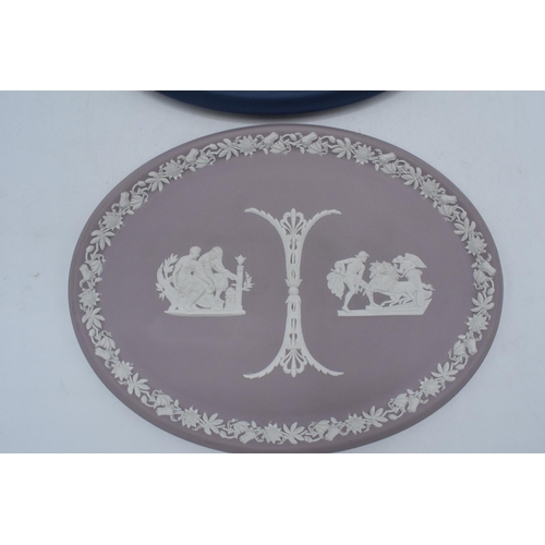 78 - A pair of Wedgwood Jasperware oval plaques to include lilac example and dark blue 'Royal Pavilion Br... 