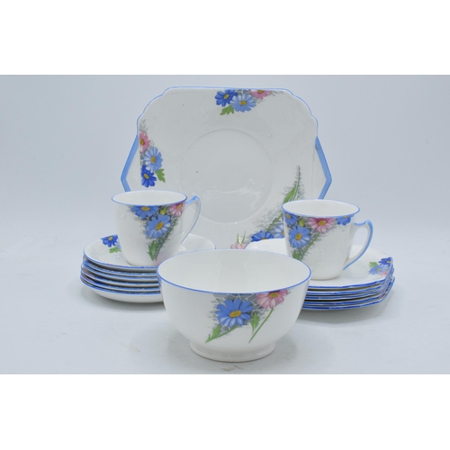 89 - Shelley Strand shaped tea set pattern 12216 to include a cake plate, 6 saucers, 5 side plates, 2 cup... 