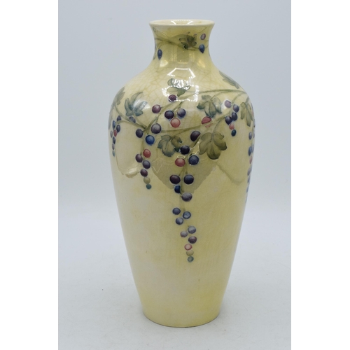 179 - Moorcroft lustre vase with grape and vine pattern, professionally restored, 27cm tall.