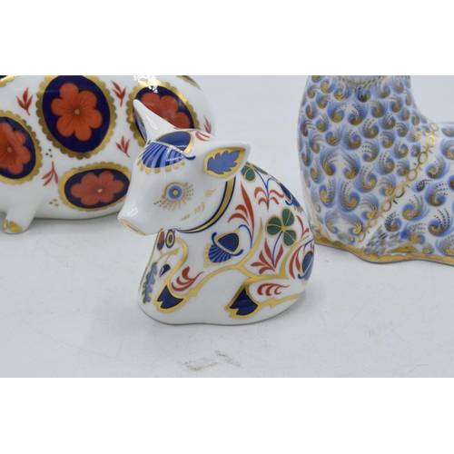 200 - A trio of Royal Crown Derby paperweights to include a Sheep, Imari Pig and Sitting Piglet , first qu... 