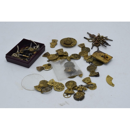 324 - A collection of gilt-brass pocket watch spares / parts to include pocket watch balance cocks, keys a... 