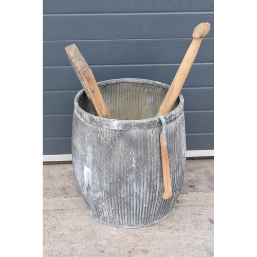 327 - A vintage galvanised dolly tub, 52cm tall, together with accessories to include wash board, wooden p... 