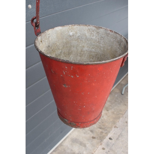 342 - Vintage metal fire bucket with swing-over handle painted red with 'FIRE' in black, 33cm tall with ha... 