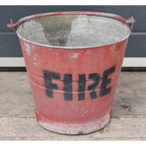 343 - Vintage metal fire bucket with swing-over handle painted red with 'FIRE' in black, 29cm tall with ha... 