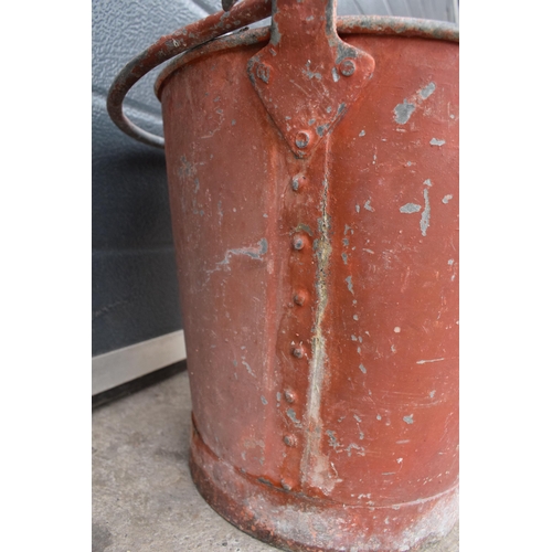 344 - Vintage metal riveted fire bucket with swing-over handle painted red with 'FIRE' in black, 31cm tall... 