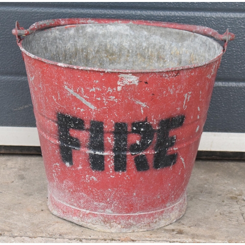 346 - Vintage metal fire bucket with swing-over handle painted red with 'FIRE' in black, 30cm tall with ha... 