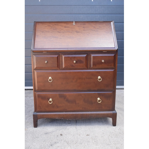 369 - Stag mid-century brown bureau with leather inset to interior. 76 x 46 x 98cm tall.