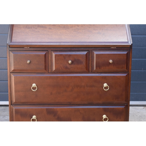 369 - Stag mid-century brown bureau with leather inset to interior. 76 x 46 x 98cm tall.