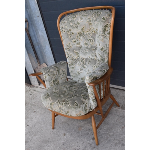 372 - Ercol spoon book mid century chair with upholstered seat, back and arm rests, 114cm tall.