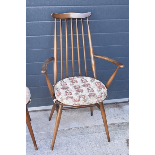 373 - A set of 4 mid century Ercol spindle-back chairs to include 2 arm chairs (4). 97cm tall.