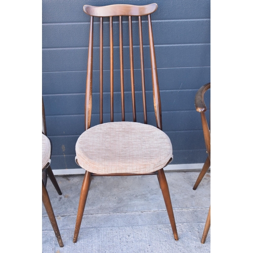 373 - A set of 4 mid century Ercol spindle-back chairs to include 2 arm chairs (4). 97cm tall.