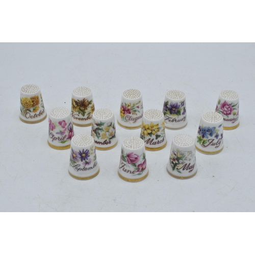 65 - A set of Royal Albert Flower of the Month thimbles, one for each month of the year, January - Decemb... 