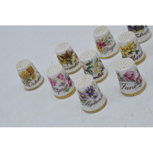 65 - A set of Royal Albert Flower of the Month thimbles, one for each month of the year, January - Decemb... 