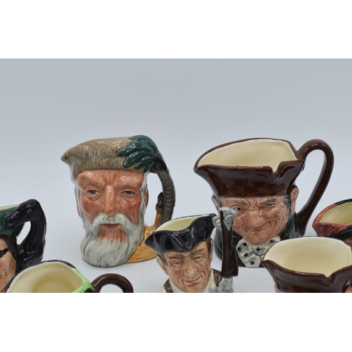 68 - A collection of small and miniature character jugs to include Robinson Crusoe, Blacksmith, Gunsmith ... 