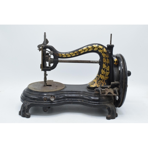 350 - Antique hand-propelled Jones & Company hand sewing machine, 38cm long.