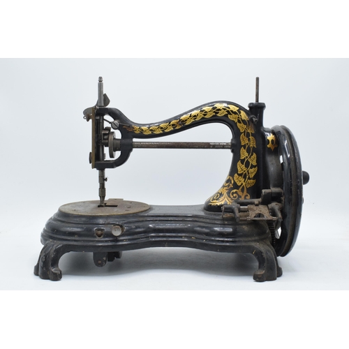 350 - Antique hand-propelled Jones & Company hand sewing machine, 38cm long.