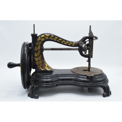 350 - Antique hand-propelled Jones & Company hand sewing machine, 38cm long.