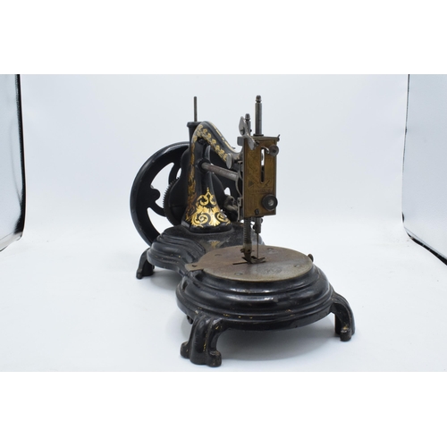 350 - Antique hand-propelled Jones & Company hand sewing machine, 38cm long.