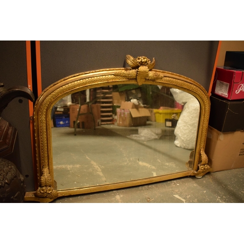 376 - 19th century over mantel mirror of arched form with gilt moulded frame with fern detail, 114cm wide.