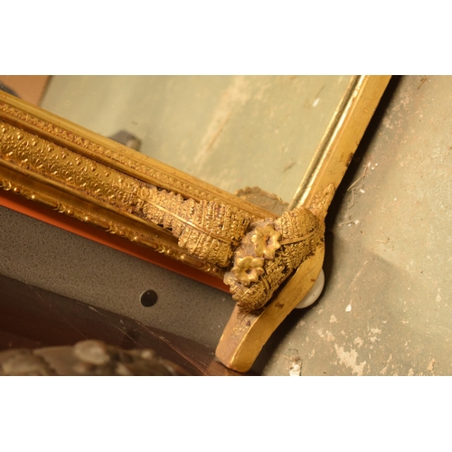 376 - 19th century over mantel mirror of arched form with gilt moulded frame with fern detail, 114cm wide.