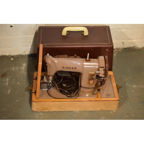 258 - A cased electric Singer sewing machine (untested).