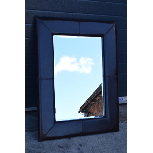 341B - Leather bound wall mirror, 106 x 80cm tall.