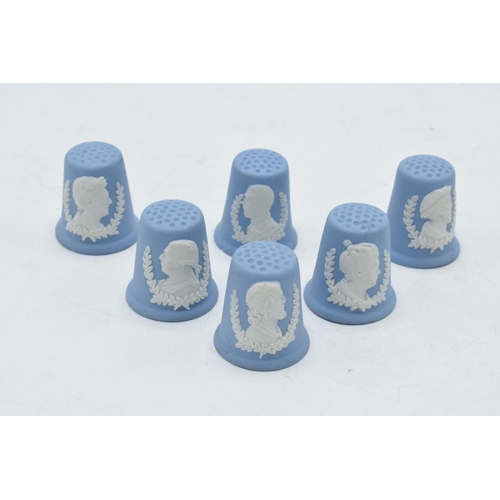 81A - A collection of 6 Wedgwood blue Jasperware thimbles with famous heads (6).