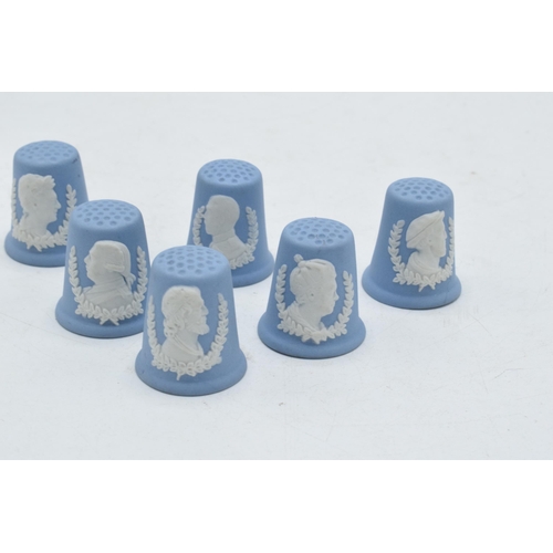 81A - A collection of 6 Wedgwood blue Jasperware thimbles with famous heads (6).