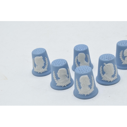 81A - A collection of 6 Wedgwood blue Jasperware thimbles with famous heads (6).