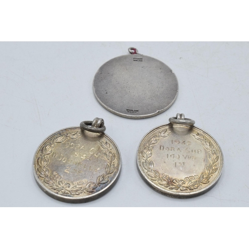 205C - A trio of silver medallions / fobs to include 2 athletic and a St Christopher (3), 41.5 grams.