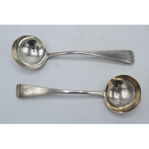 205D - Georgian hallmarked silver pair of ladles, London 1817 and 1820, 100.6 grams. 17cm long.