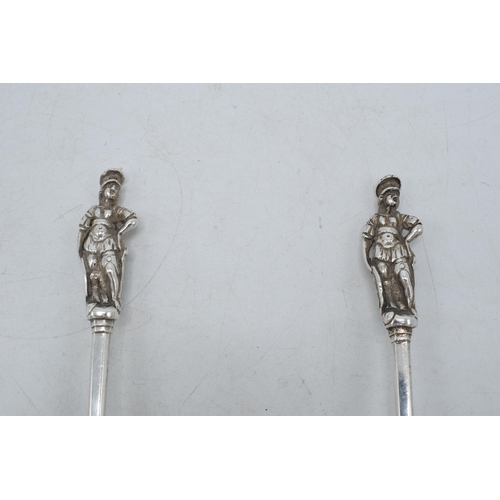 205E - A pair of ornate Victorian silver spoons, London 1874, 126.1 grams. 19.5cm long.