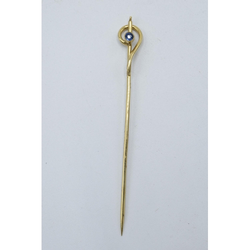 205P - 9ct gold stick pin set with sapphire, 1.2 grams, 6cm long.