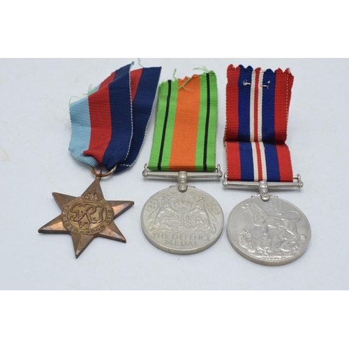 246B - World War Two (WW2) service medal trio to include Defence Medal, 1939-1945 medal and 1939-1945 Star ... 