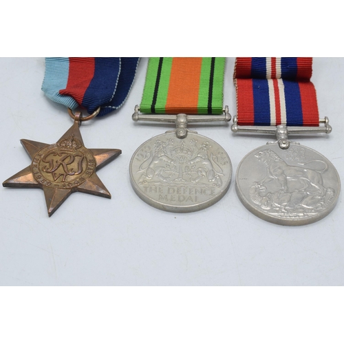 246B - World War Two (WW2) service medal trio to include Defence Medal, 1939-1945 medal and 1939-1945 Star ... 