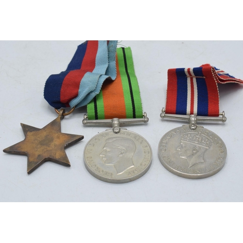 246B - World War Two (WW2) service medal trio to include Defence Medal, 1939-1945 medal and 1939-1945 Star ... 