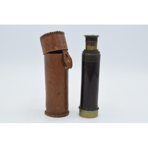 252A - Pocket 4 draw brass telescope in leather case.