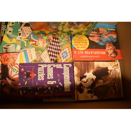 309 - A large collection of vintage and similar boxed toys to include board games, activities and toys (Qt... 