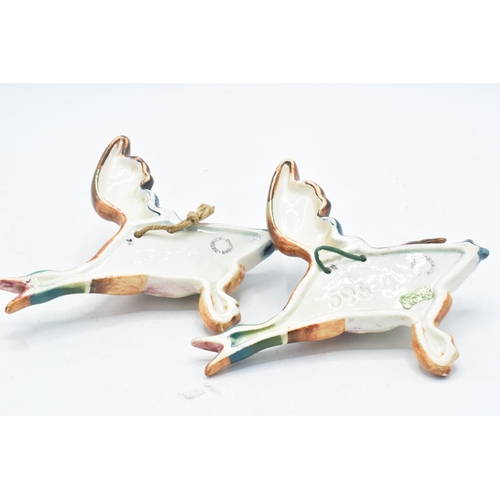 129 - Beswick Flying Mallards wall plaques, both 596-4 (2).