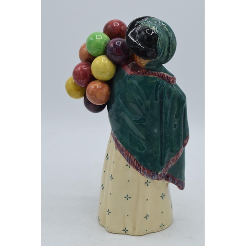 140 - Early Royal Doulton figure The Balloon Seller HN583 (some restoration to rear of hat).