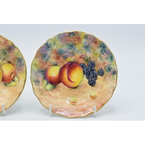 20 - A near pair of G. Delaney (former Royal Worcester artist) still-life fruit scene dishes (2), 12cm di... 