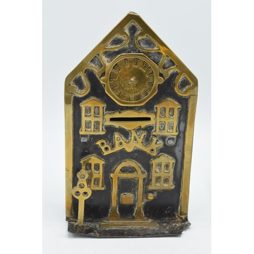 220 - Victorian brass and cast iron money box in the form of a bank with a clock together together with ca... 