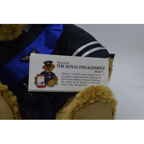 231 - A pair of teddy bears to include The Great British Bear Company HRH William Engagement bear together... 