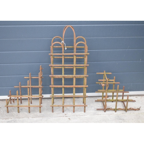 239 - A trio of vintage bent metal wine bottle holders in the form of an arched example and 2 small items,... 