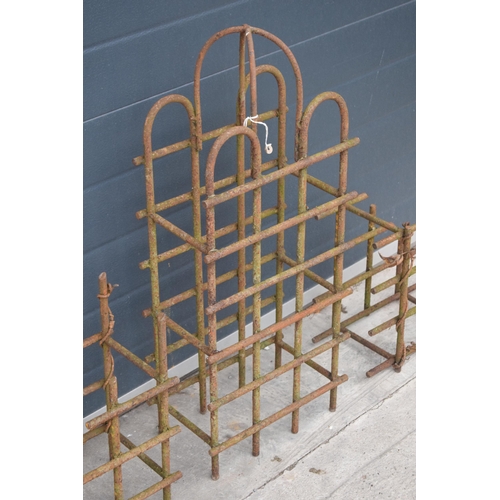 239 - A trio of vintage bent metal wine bottle holders in the form of an arched example and 2 small items,... 