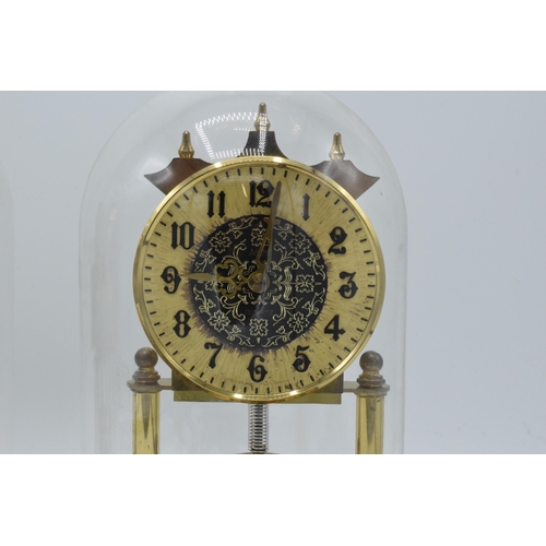 266 - A pair of vintage anniversary clocks in domed cases, ticking order (2).