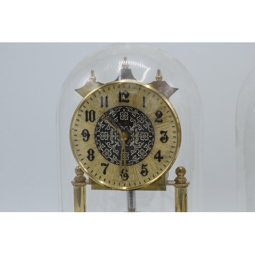 266 - A pair of vintage anniversary clocks in domed cases, ticking order (2).