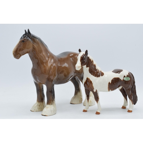 54 - Beswick 818 brown shire together with Skewbald pinto pony (small chip to ear) (2).