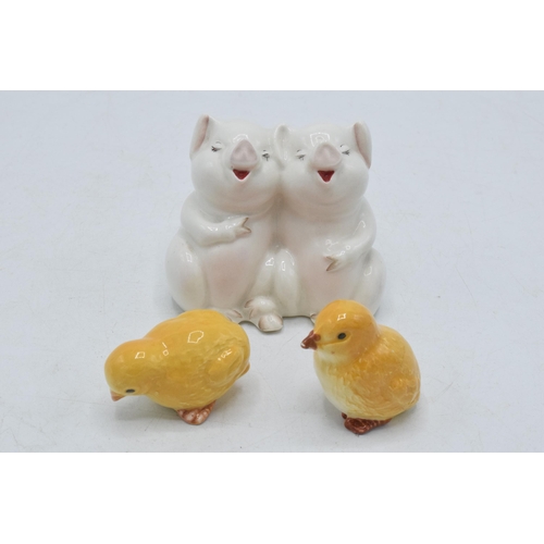 56 - Beswick animals to include chick pecking 2201, seated 2202 and comical pigs 2103 (one chick damaged)... 